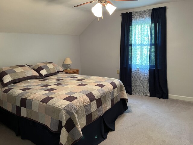 261 W Main St, Hart, MI 49420 - bedroom with light carpet, lofted ceiling, and ceiling fan