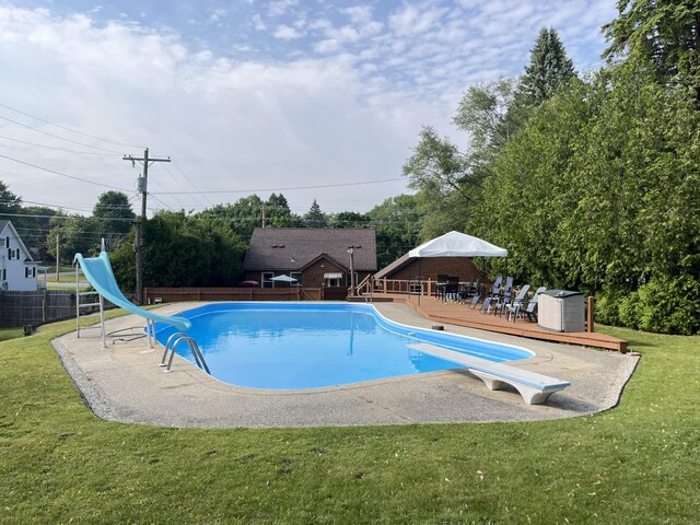 261 W Main St, Hart, MI 49420 - view of swimming pool featuring a water slide and a diving board