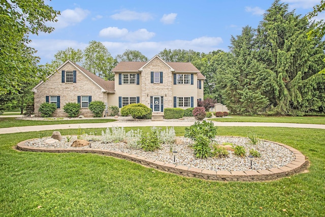 17872 Victors Ln, Marshall, MI 49068 - colonial house featuring a front yard and brick siding