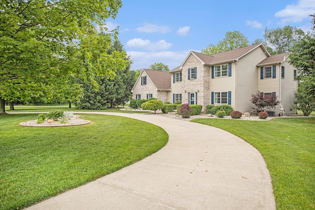 17872 Victors Ln, Marshall, MI 49068 - colonial house with a front yard and brick siding