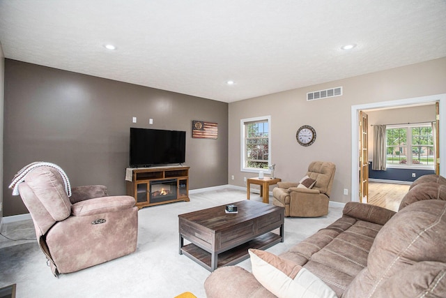 17872 Victors Ln, Marshall, MI 49068 - living area with healthy amount of natural light, light carpet, and recessed lighting