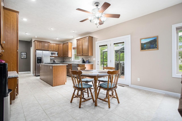 17872 Victors Ln, Marshall, MI 49068 - dining space with ceiling fan, recessed lighting, and light tile patterned floors