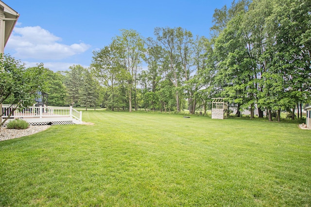 17872 Victors Ln, Marshall, MI 49068 - view of green lawn featuring a wooden deck