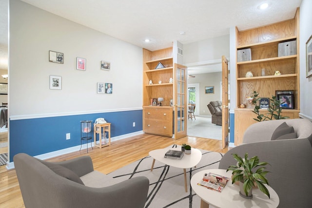 17872 Victors Ln, Marshall, MI 49068 - living room featuring light wood finished floors, french doors, and recessed lighting