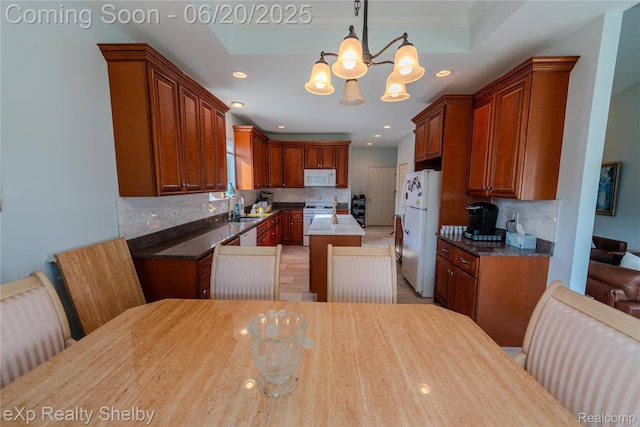 24986 Murray St, Harrison Township, MI 48045 - kitchen with white appliances, a chandelier, backsplash, recessed lighting, and pendant lighting
