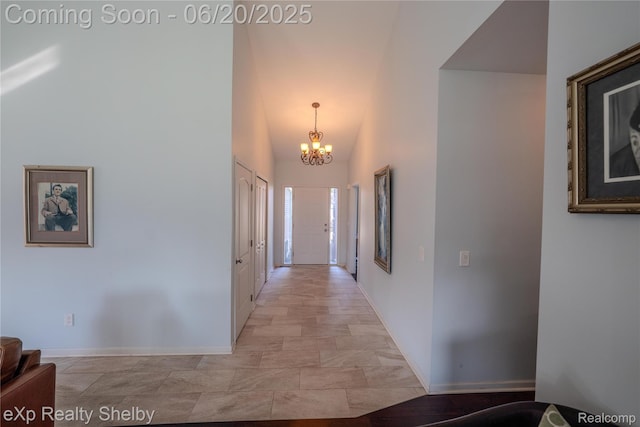 24986 Murray St, Harrison Township, MI 48045 - hallway with a chandelier and light stone finish floors