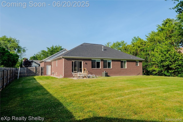 24986 Murray St, Harrison Township, MI 48045 - rear view of house featuring a fenced backyard, brick siding, and a patio area