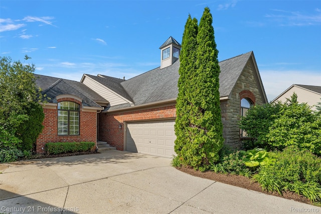 4013 Ardsley Ct, Clarkston, MI 48348 - view of front facade featuring driveway, a garage, brick siding, and a shingled roof
