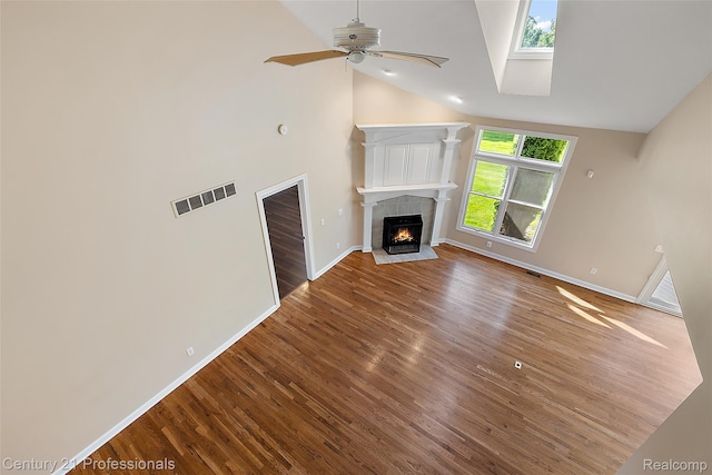 4013 Ardsley Ct, Clarkston, MI 48348 - unfurnished living room with wood finished floors, ceiling fan, high vaulted ceiling, and a fireplace