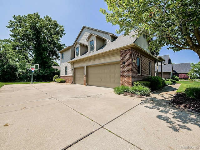 8595 Eastway Dr, White Lake, MI 48386 - view of side of property featuring brick siding, concrete driveway, a garage, and a shingled roof