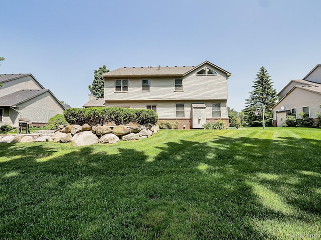 8595 Eastway Dr, White Lake, MI 48386 - rear view of house featuring a lawn and brick siding