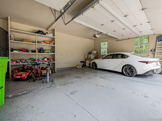 8595 Eastway Dr, White Lake, MI 48386 - garage with a garage door opener