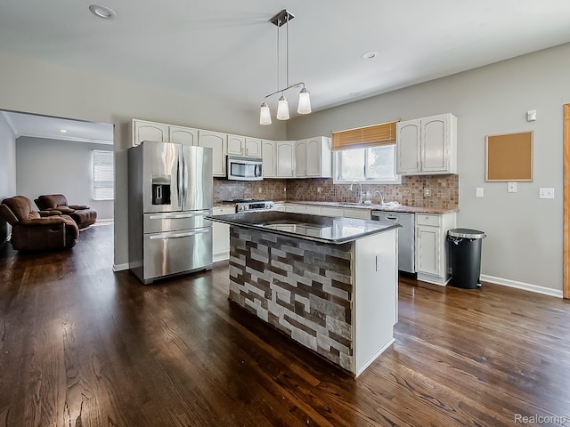8595 Eastway Dr, White Lake, MI 48386 - kitchen featuring stainless steel appliances, white cabinets, dark wood-style flooring, decorative backsplash, and recessed lighting