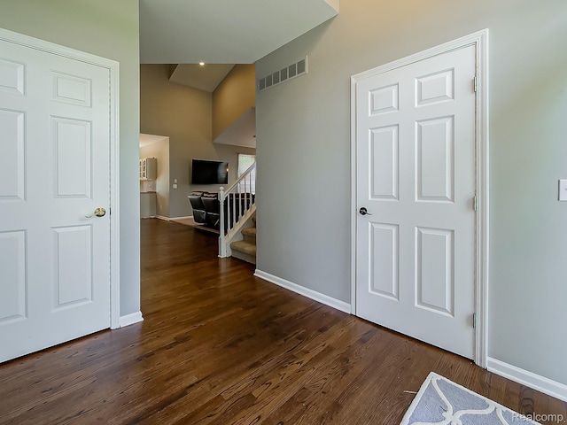 8595 Eastway Dr, White Lake, MI 48386 - hallway with dark wood-type flooring and baseboards