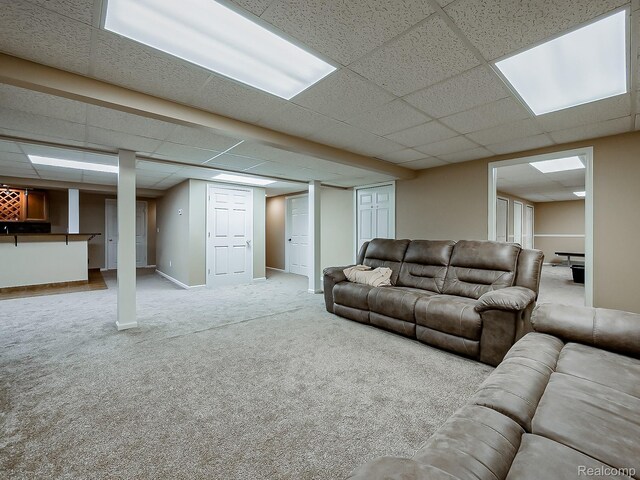 8595 Eastway Dr, White Lake, MI 48386 - carpeted living area with a drop ceiling and baseboards