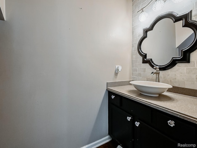 8595 Eastway Dr, White Lake, MI 48386 - bathroom featuring backsplash and vanity