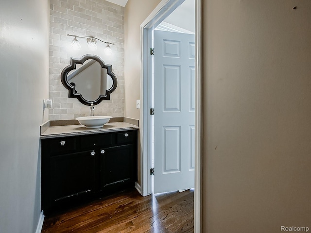 8595 Eastway Dr, White Lake, MI 48386 - bathroom featuring wood finished floors and vanity