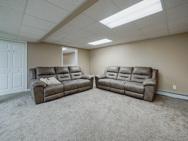 8595 Eastway Dr, White Lake, MI 48386 - carpeted living room featuring a drop ceiling and a baseboard radiator