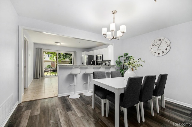 28139 Carlton Way Dr, Novi, MI 48377 - dining room featuring a chandelier and dark wood finished floors