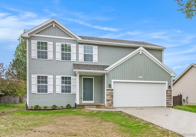 739 Lone Oak Way, Tecumseh, MI 49286 - view of front of house featuring driveway, stone siding, board and batten siding, and an attached garage