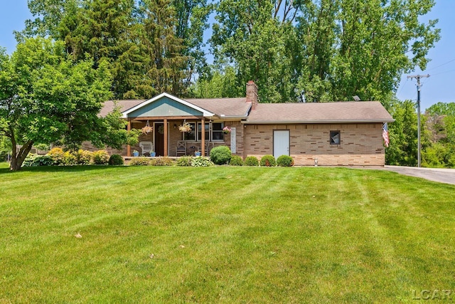 13936 Allen Rd, Clinton, MI 49236 - single story home with covered porch, brick siding, and a front lawn