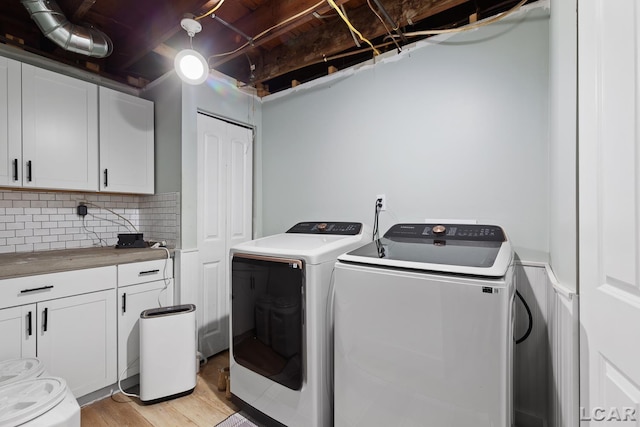 13936 Allen Rd, Clinton, MI 49236 - laundry area featuring washing machine and dryer and light wood-style flooring