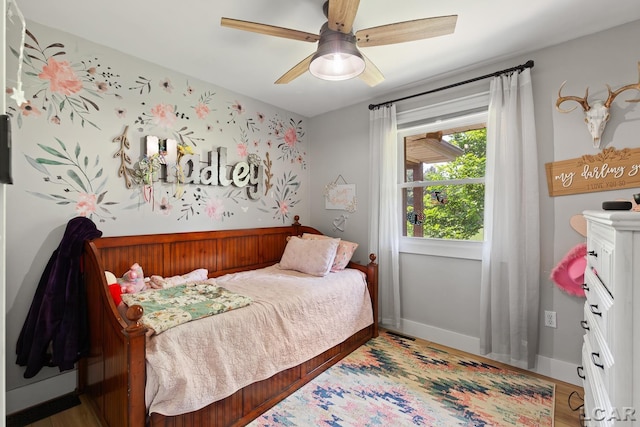 13936 Allen Rd, Clinton, MI 49236 - bedroom featuring wood finished floors and a ceiling fan