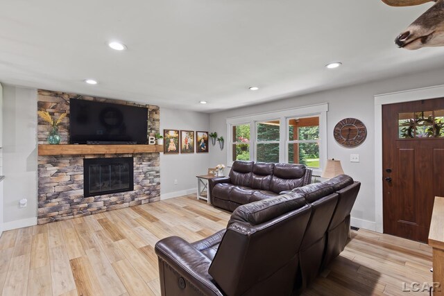 13936 Allen Rd, Clinton, MI 49236 - living room with a fireplace, wood finished floors, and recessed lighting