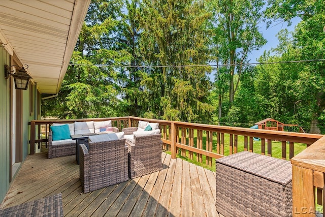 13936 Allen Rd, Clinton, MI 49236 - wooden deck featuring an outdoor hangout area, a playground, and view of scattered trees