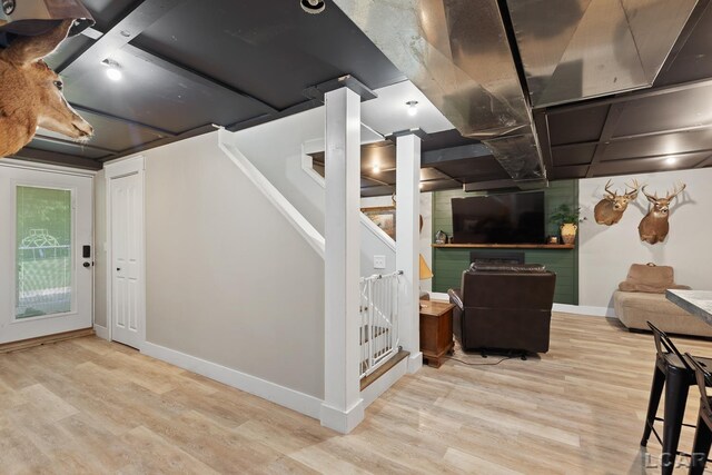 13936 Allen Rd, Clinton, MI 49236 - below grade area featuring wood finished floors and stairs