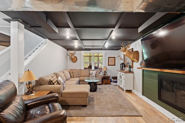 13936 Allen Rd, Clinton, MI 49236 - living area with light wood-style floors, a glass covered fireplace, and stairway