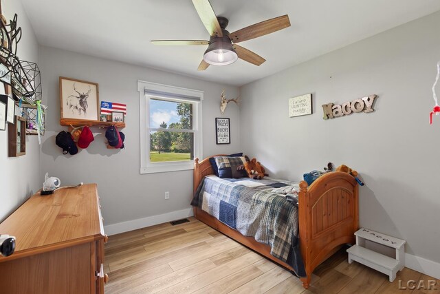 13936 Allen Rd, Clinton, MI 49236 - bedroom featuring light wood-type flooring and a ceiling fan