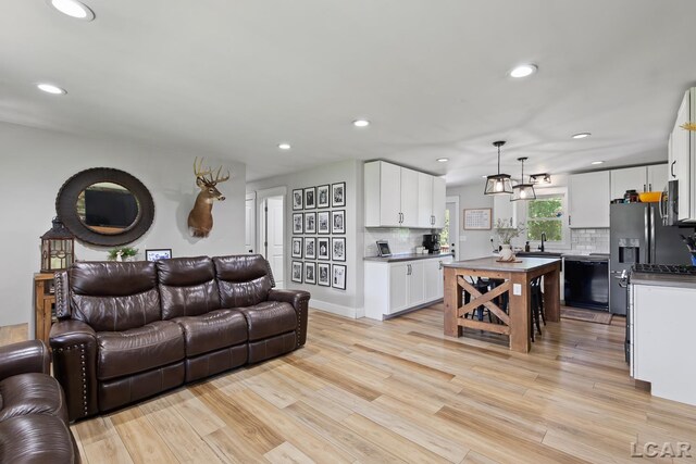 13936 Allen Rd, Clinton, MI 49236 - living room featuring recessed lighting and light wood-type flooring