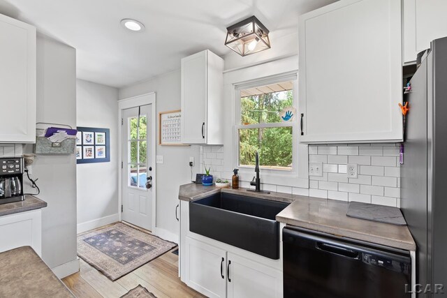 13936 Allen Rd, Clinton, MI 49236 - kitchen with dishwasher, freestanding refrigerator, white cabinetry, light wood-style floors, and recessed lighting