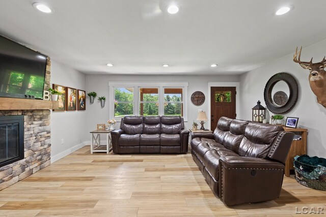 13936 Allen Rd, Clinton, MI 49236 - living room with recessed lighting, a fireplace, and light wood-style floors