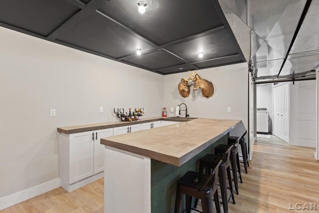 13936 Allen Rd, Clinton, MI 49236 - indoor bar with washer / clothes dryer and light wood-style flooring