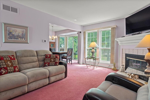 3059 Ailsa Craig, Ann Arbor, MI 48108 - carpeted living area featuring a chandelier and a fireplace