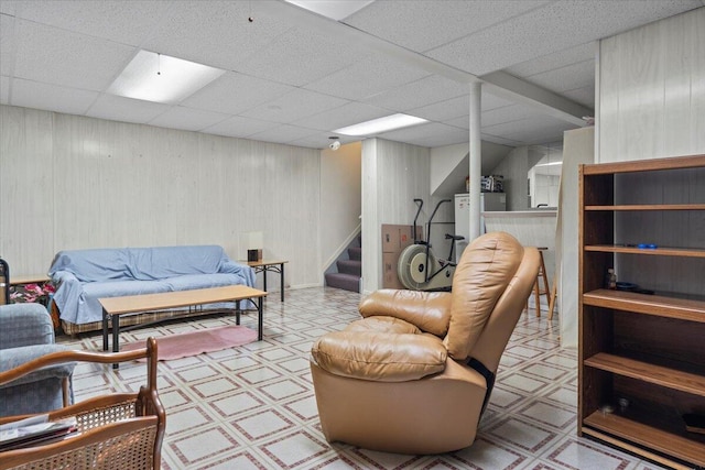 3059 Ailsa Craig, Ann Arbor, MI 48108 - living room featuring tile patterned floors, a drop ceiling, stairway, and wood walls