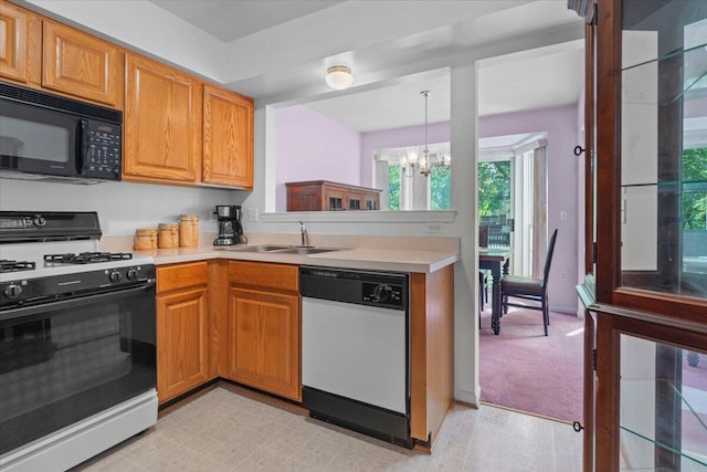 3059 Ailsa Craig, Ann Arbor, MI 48108 - kitchen with gas stove, white dishwasher, black microwave, light countertops, and a chandelier
