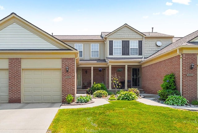 3059 Ailsa Craig, Ann Arbor, MI 48108 - traditional-style house with driveway, brick siding, and a front yard