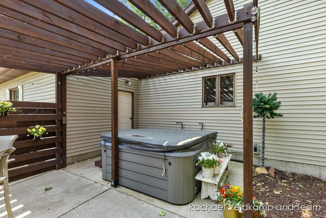 1579 Geddes Ave NW, Grand Rapids, MI 49534 - view of patio / terrace with a hot tub and a pergola