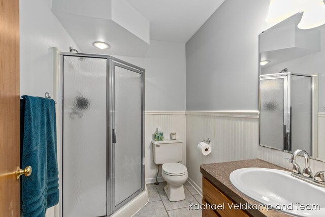 1579 Geddes Ave NW, Grand Rapids, MI 49534 - bathroom with vanity, tile patterned floors, a stall shower, and wainscoting