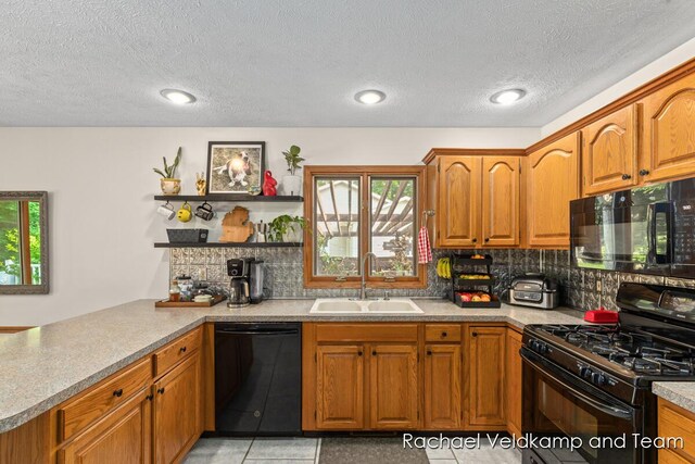1579 Geddes Ave NW, Grand Rapids, MI 49534 - kitchen featuring black appliances, open shelves, tasteful backsplash, a peninsula, and brown cabinets