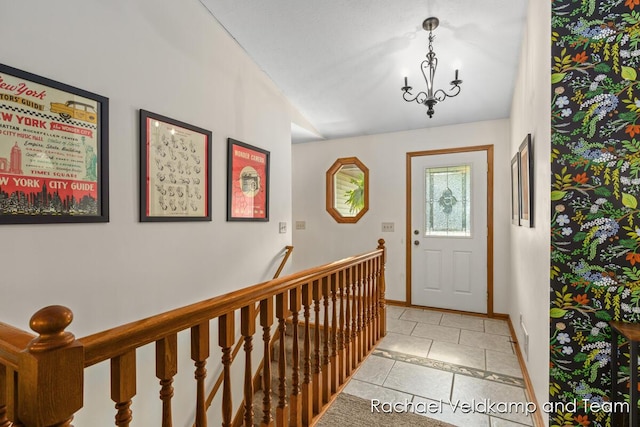1579 Geddes Ave NW, Grand Rapids, MI 49534 - entryway featuring light tile patterned floors and a chandelier