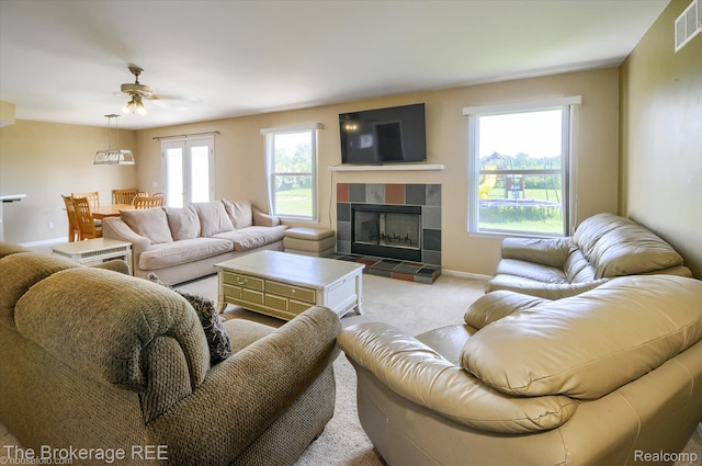 1484 E Baldwin Rd, Grand Blanc, MI 48439 - carpeted living room featuring a fireplace and ceiling fan