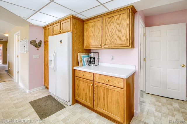 1484 E Baldwin Rd, Grand Blanc, MI 48439 - kitchen featuring white fridge with ice dispenser, light countertops, and brown cabinetry