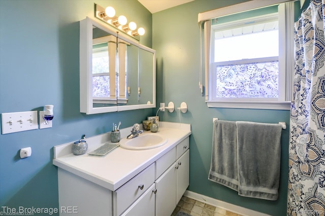 1484 E Baldwin Rd, Grand Blanc, MI 48439 - full bathroom featuring vanity and baseboards