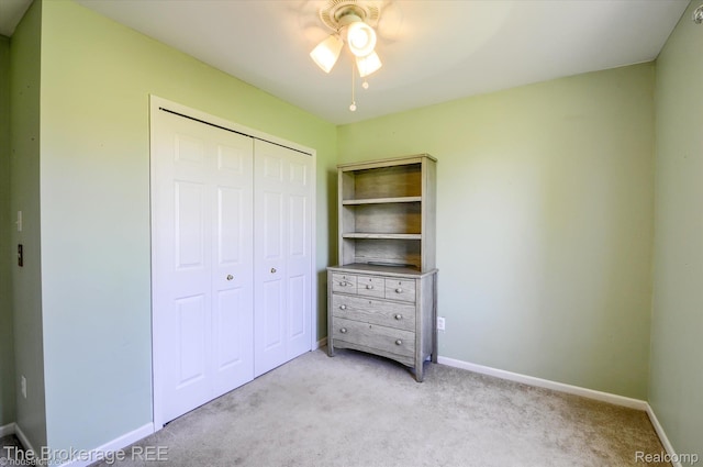 1484 E Baldwin Rd, Grand Blanc, MI 48439 - bedroom featuring a closet, light carpet, and ceiling fan