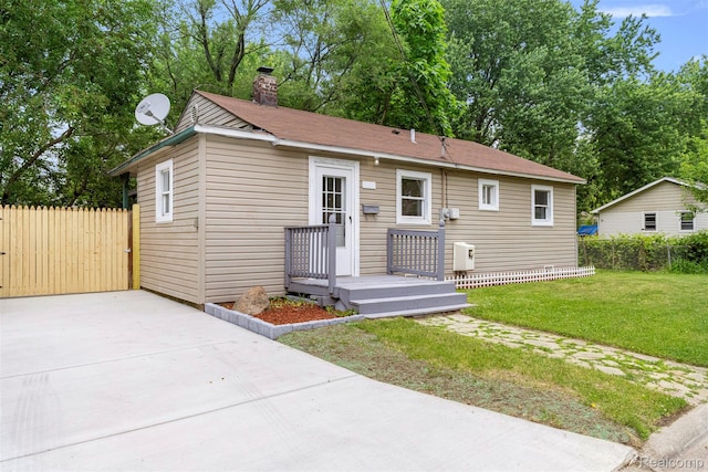 33420 Bentley Ct, Westland, MI 48186 - view of front facade featuring a chimney and driveway