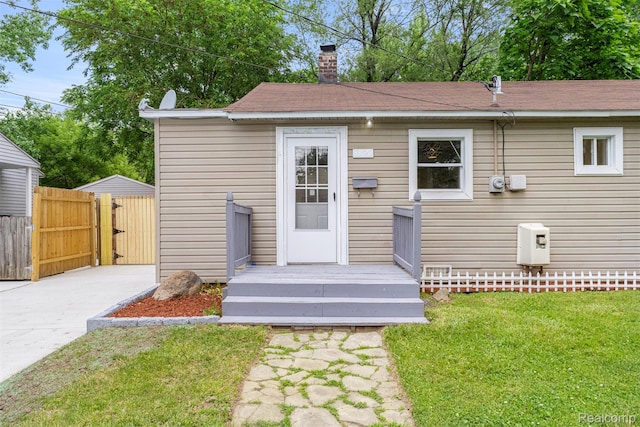 33420 Bentley Ct, Westland, MI 48186 - rear view of property featuring a chimney and a gate